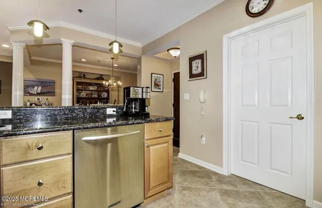 a bathroom with a granite countertop sink a mirror and a shower