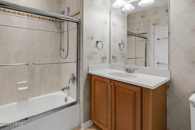 a view of a porch with wooden chairs