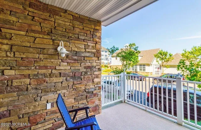 a view of a chair and table in the balcony