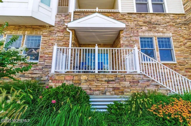 a view of a chair and tables in the balcony
