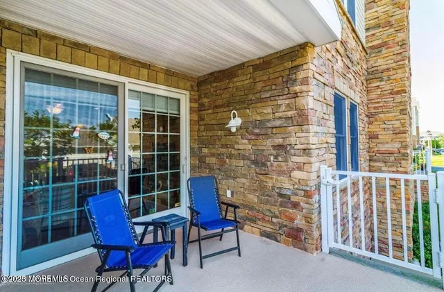a kitchen with granite countertop a stove microwave and sink