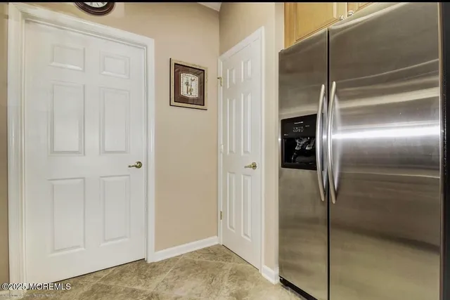 a view of a refrigerator in kitchen