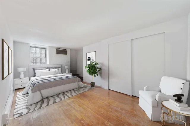 a bedroom with a bed and window