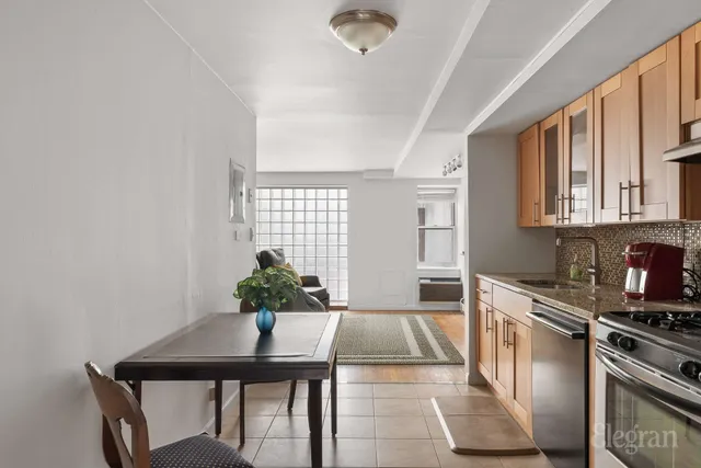 a bedroom with a bed and ceiling fan