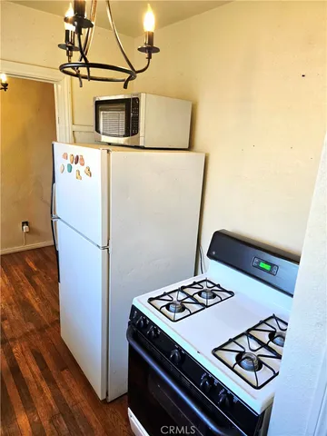a white refrigerator freezer sitting inside of a kitchen