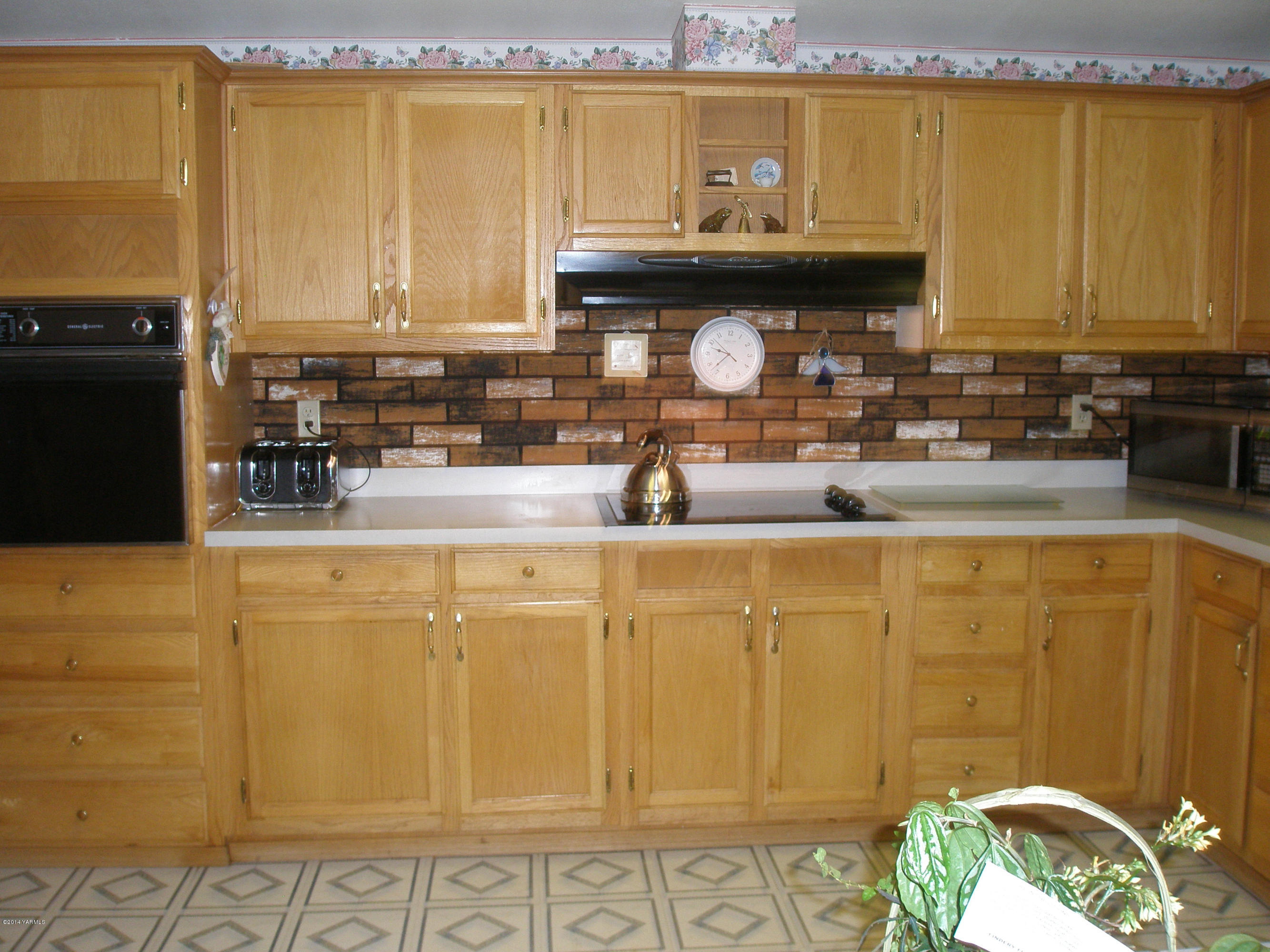 151 West Huntzinger Road Selah, WA 98942 - Photo 8 of 44 a kitchen with stainless steel appliances granite countertop a sink and cabinets