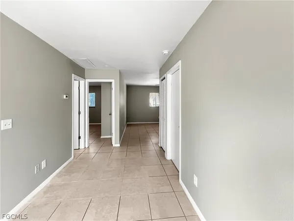 a view of a hallway with an empty room