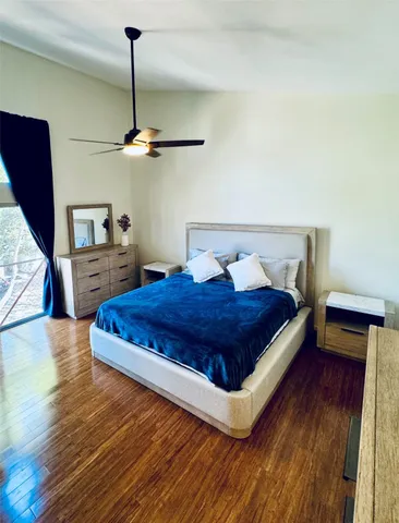 a view of kitchen with white cabinets
