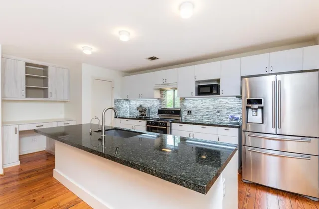 a living room with furniture and a rug
