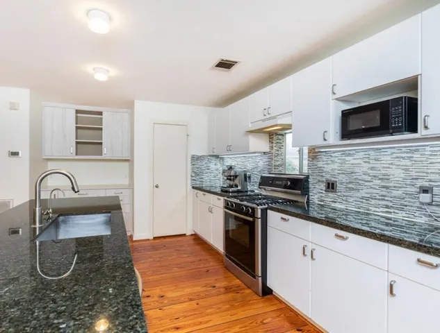 a view of kitchen and wooden floor
