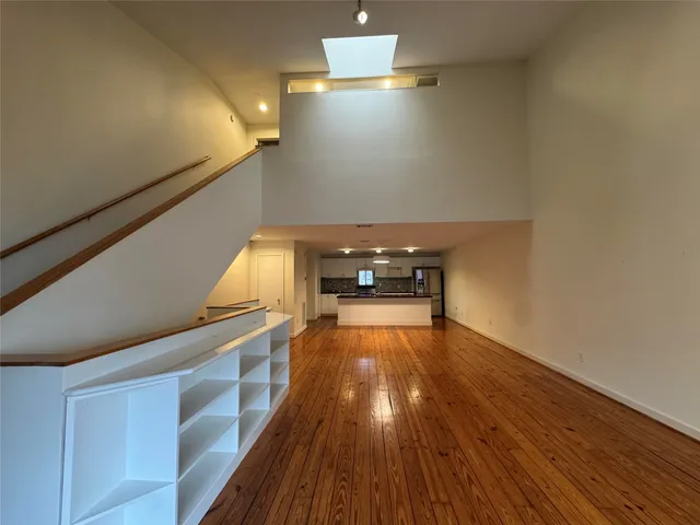 a kitchen with stainless steel appliances granite countertop a sink and a stove