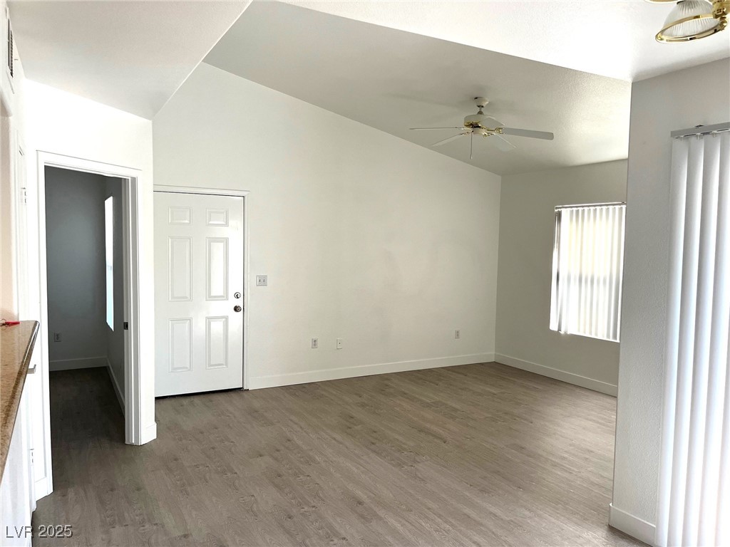 Family room with high ceilings and luxury wood floors