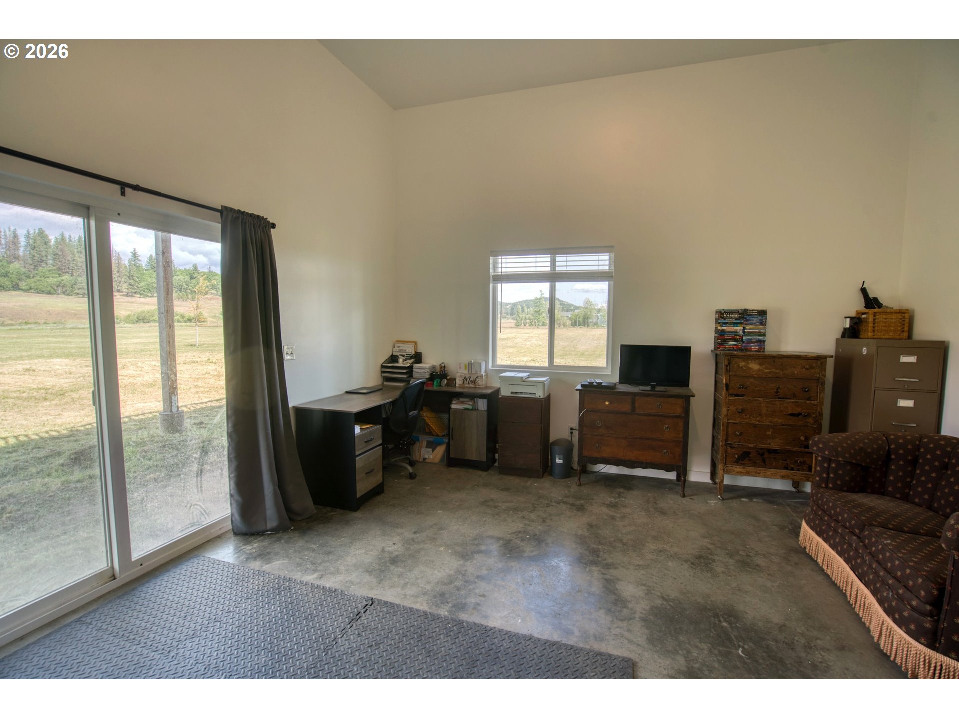 19 Inverness Road Goldendale, WA 98620 - Photo 39 of 48 a living room with furniture windows and flat screen tv