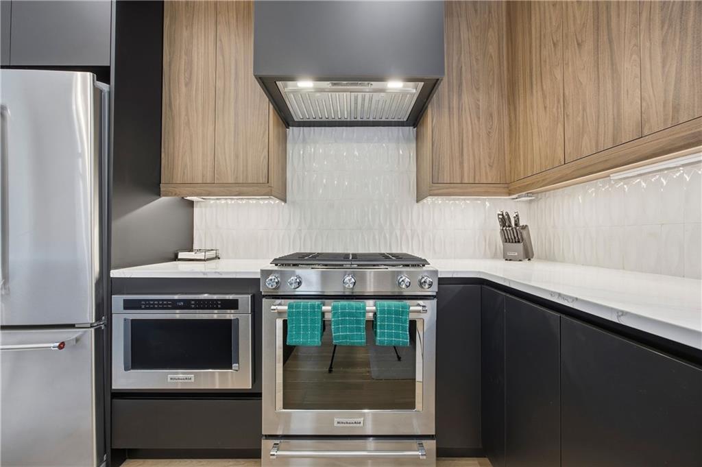 Undisclosed Address Atlanta, GA 30313 - Photo 12 of 38 a kitchen with a stove and a refrigerator