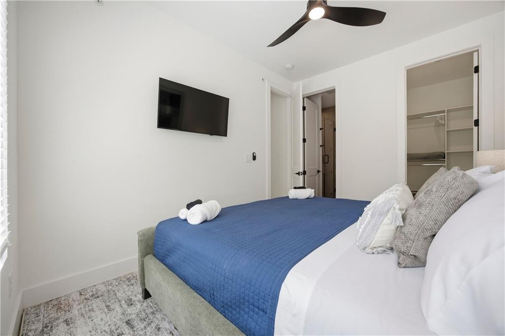 Undisclosed Address Atlanta, GA 30313 - Photo 25 of 38 a bedroom with a bed and a flat screen tv
