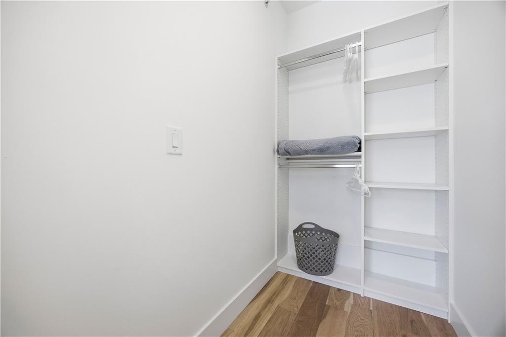 Undisclosed Address Atlanta, GA 30313 - Photo 26 of 38 a view of an empty walk in closet