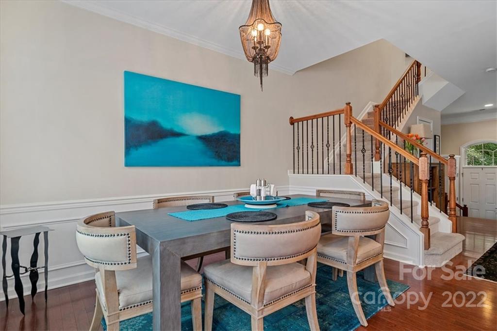 647 6th Baxter Crossing Fort Mill, SC 29708 - Photo 13 of 34 a dining room with furniture and a chandelier