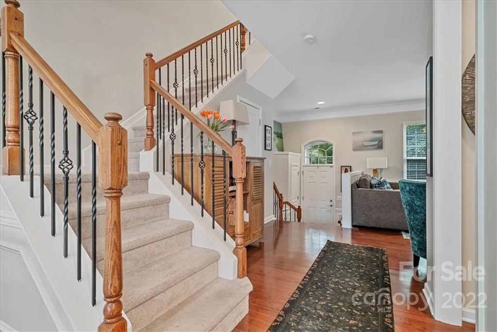 647 6th Baxter Crossing Fort Mill, SC 29708 - Photo 15 of 34 a living room with wooden floor and stairs
