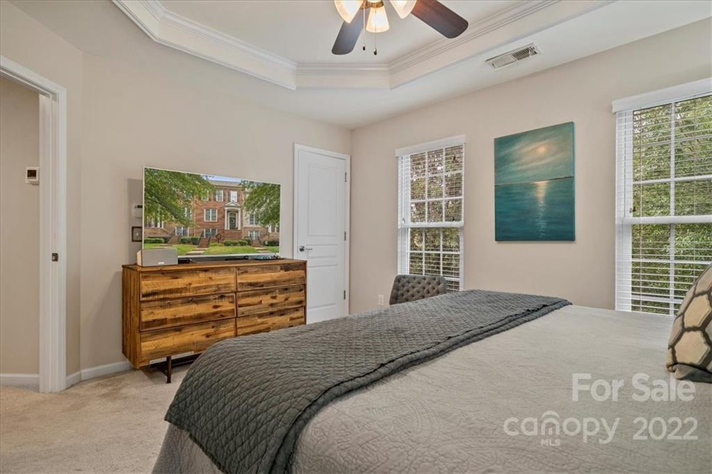 647 6th Baxter Crossing Fort Mill, SC 29708 - Photo 17 of 34 a bedroom with a bed and a dresser