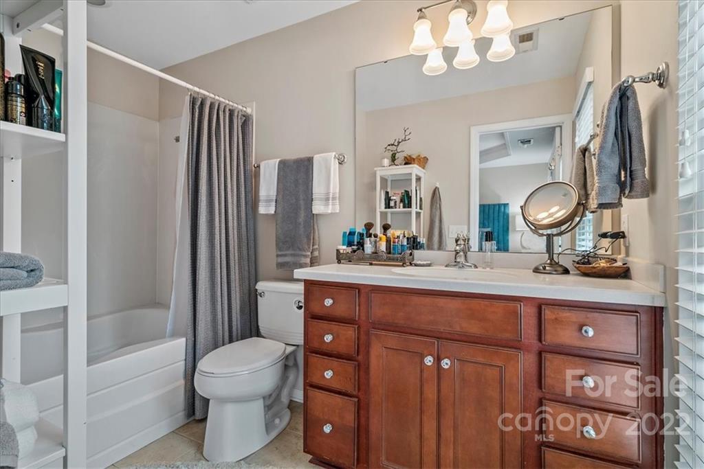 647 6th Baxter Crossing Fort Mill, SC 29708 - Photo 18 of 34 a bathroom with a toilet a sink and a mirror