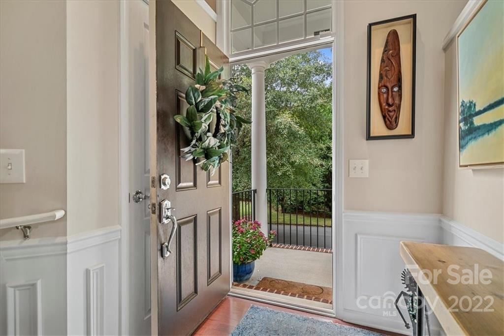 647 6th Baxter Crossing Fort Mill, SC 29708 - Photo 2 of 34 a view of entryway with a floor to ceiling window and wooden floor
