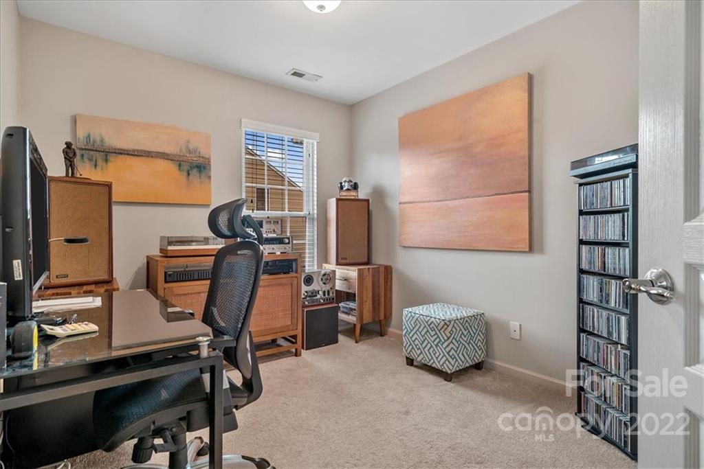 647 6th Baxter Crossing Fort Mill, SC 29708 - Photo 23 of 34 a room with gym equipment and a window