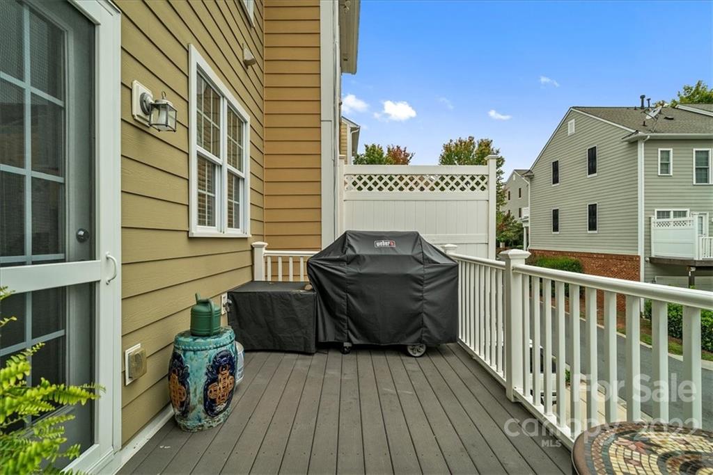 647 6th Baxter Crossing Fort Mill, SC 29708 - Photo 33 of 34 a view of a balcony with chair and wooden floor