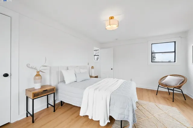 a bedroom with a bed and a chair