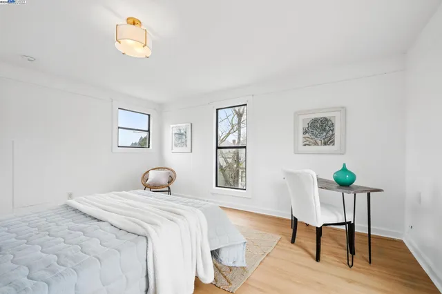 a bedroom with a bed and a table