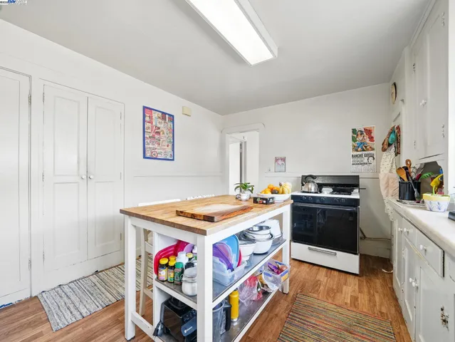 a kitchen with stainless steel appliances granite countertop a stove and a refrigerator