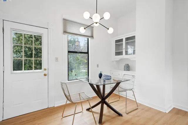 a view of a dining room with furniture window and wooden floor