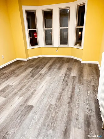 a view of an empty room with windows