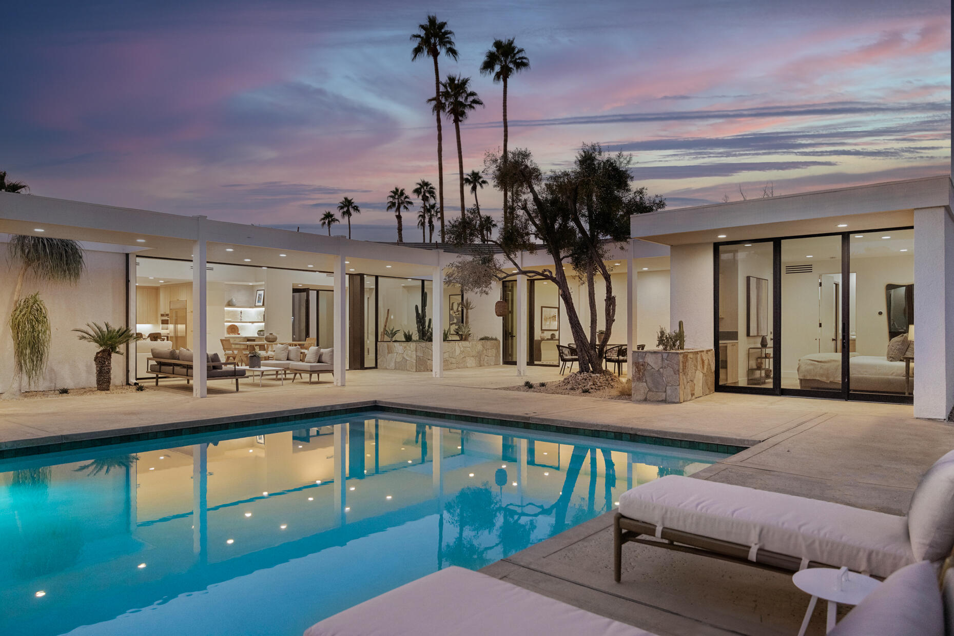 a view of a living room and chandelier