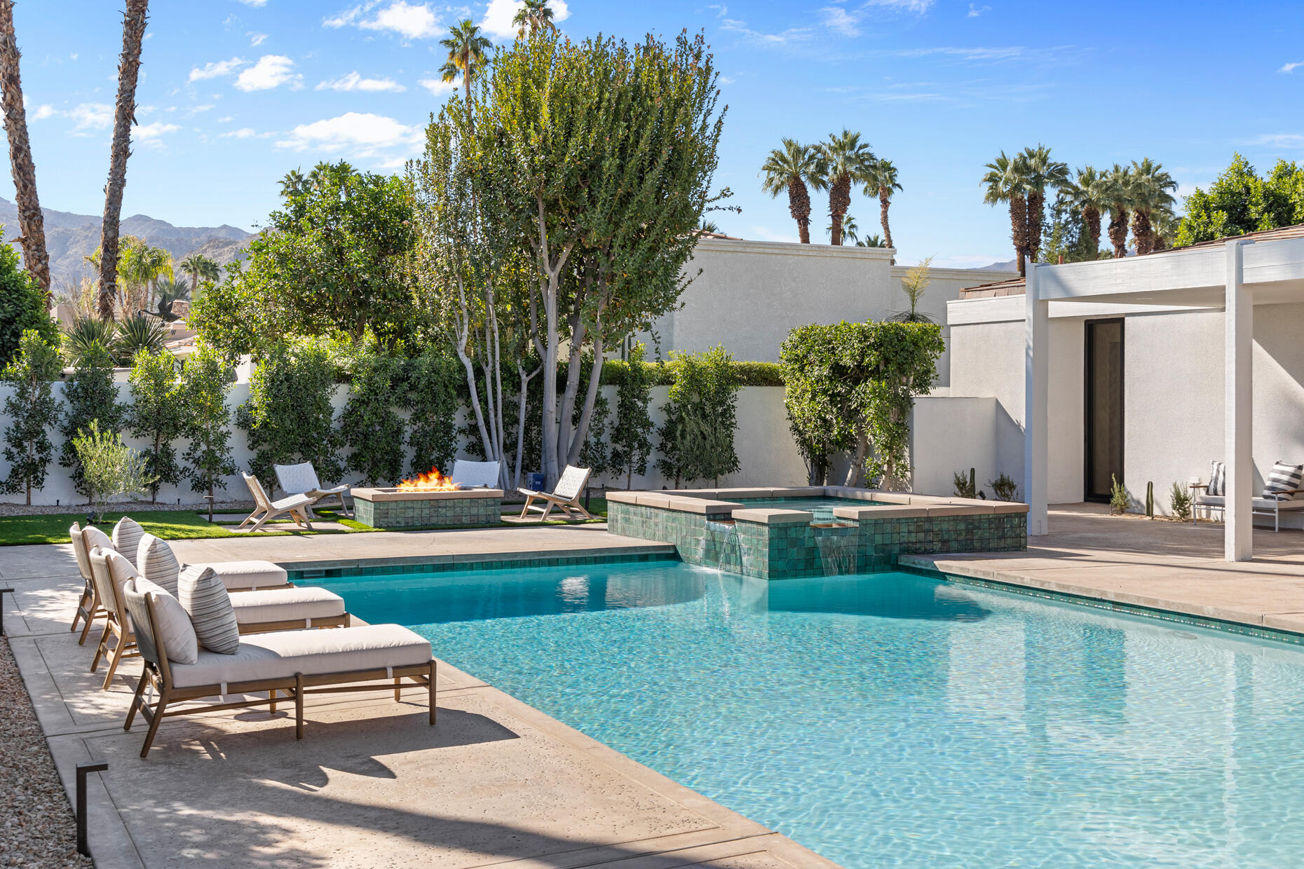 45560 Williams Road Indian Wells, CA 92210 - Photo 11 of 60 a view of a swimming pool with chairs in patio