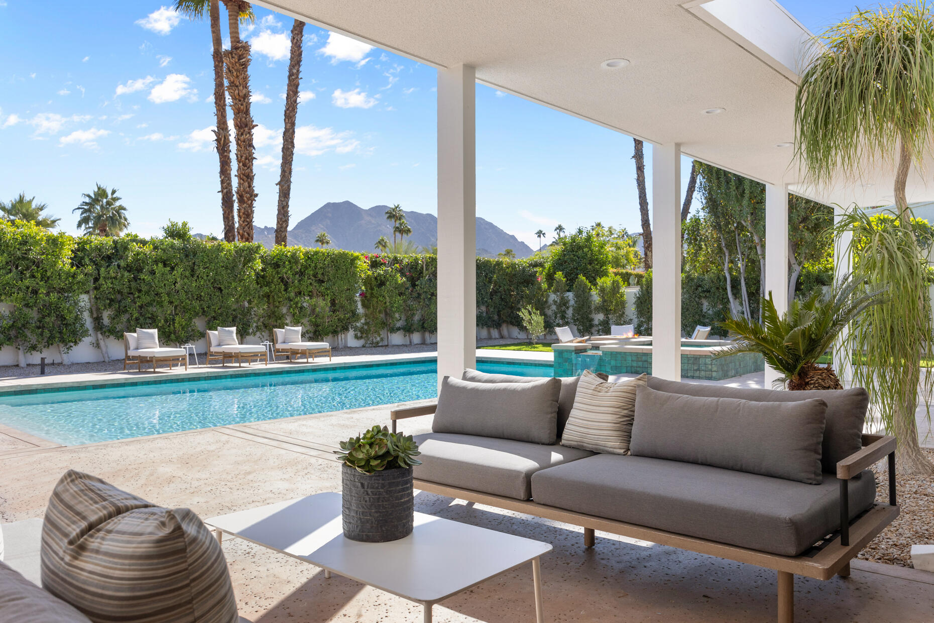 45560 Williams Road Indian Wells, CA 92210 - Photo 15 of 60 a living room with patio furniture and a garden