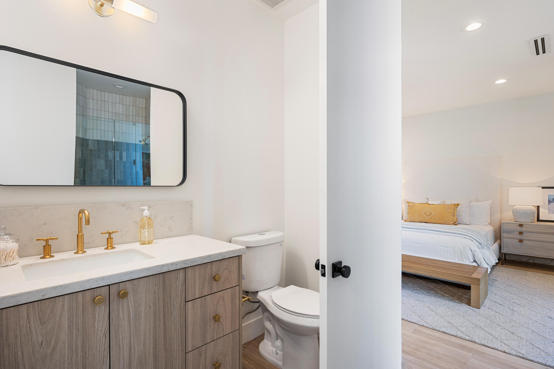 45560 Williams Road Indian Wells, CA 92210 - Photo 37 of 60 a bathroom with a double vanity sink toilet and mirror