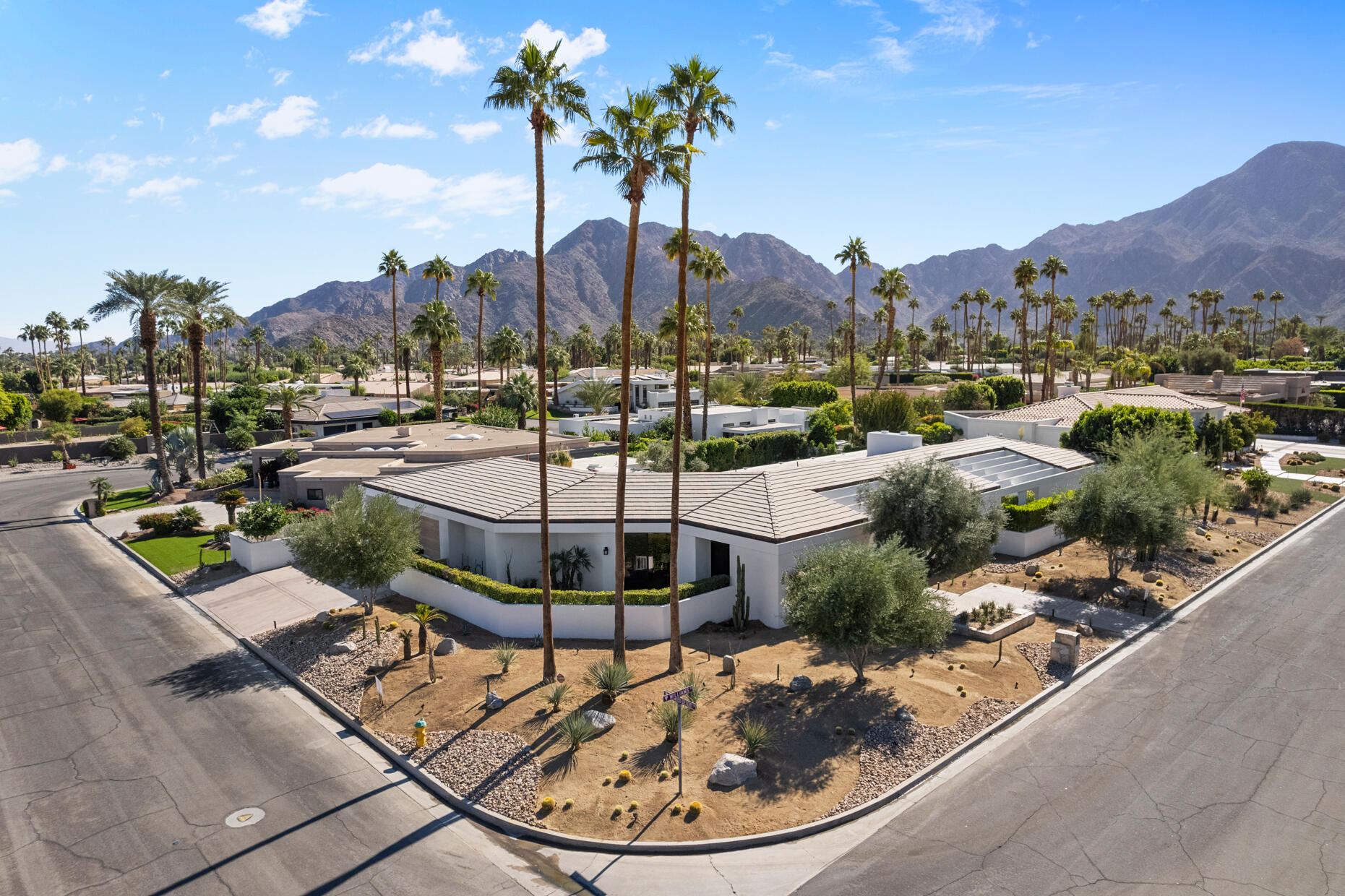 45560 Williams Road Indian Wells, CA 92210 - Photo 57 of 60 a view of a swimming pool with a patio and a garden