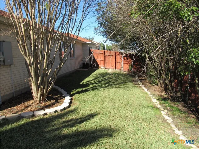 a view of swimming pool with a yard