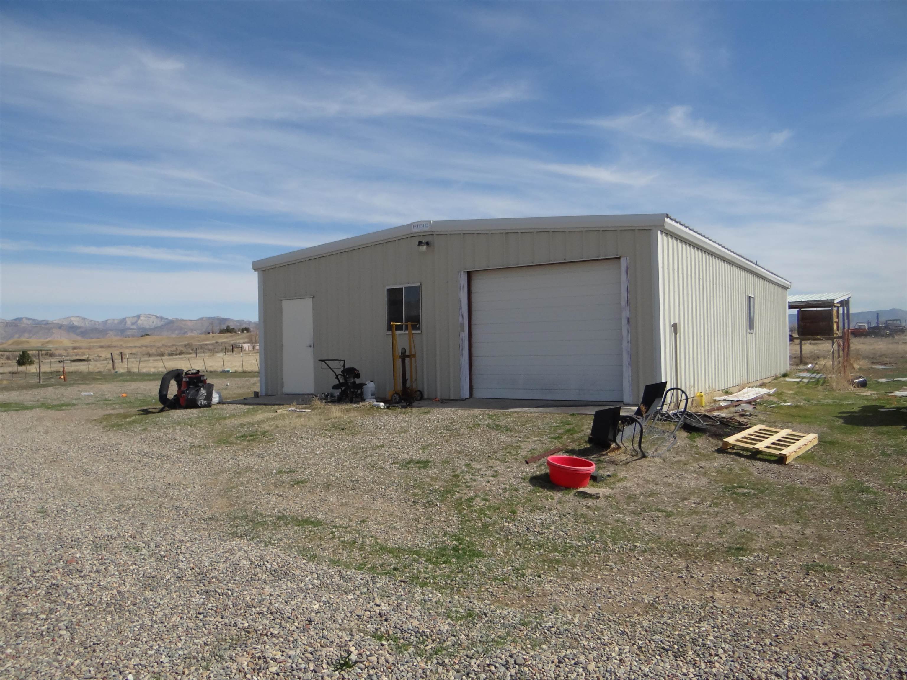 1719 P Road Loma, CO 81524 - Photo 3 of 12 a view of a dirt road and utility room