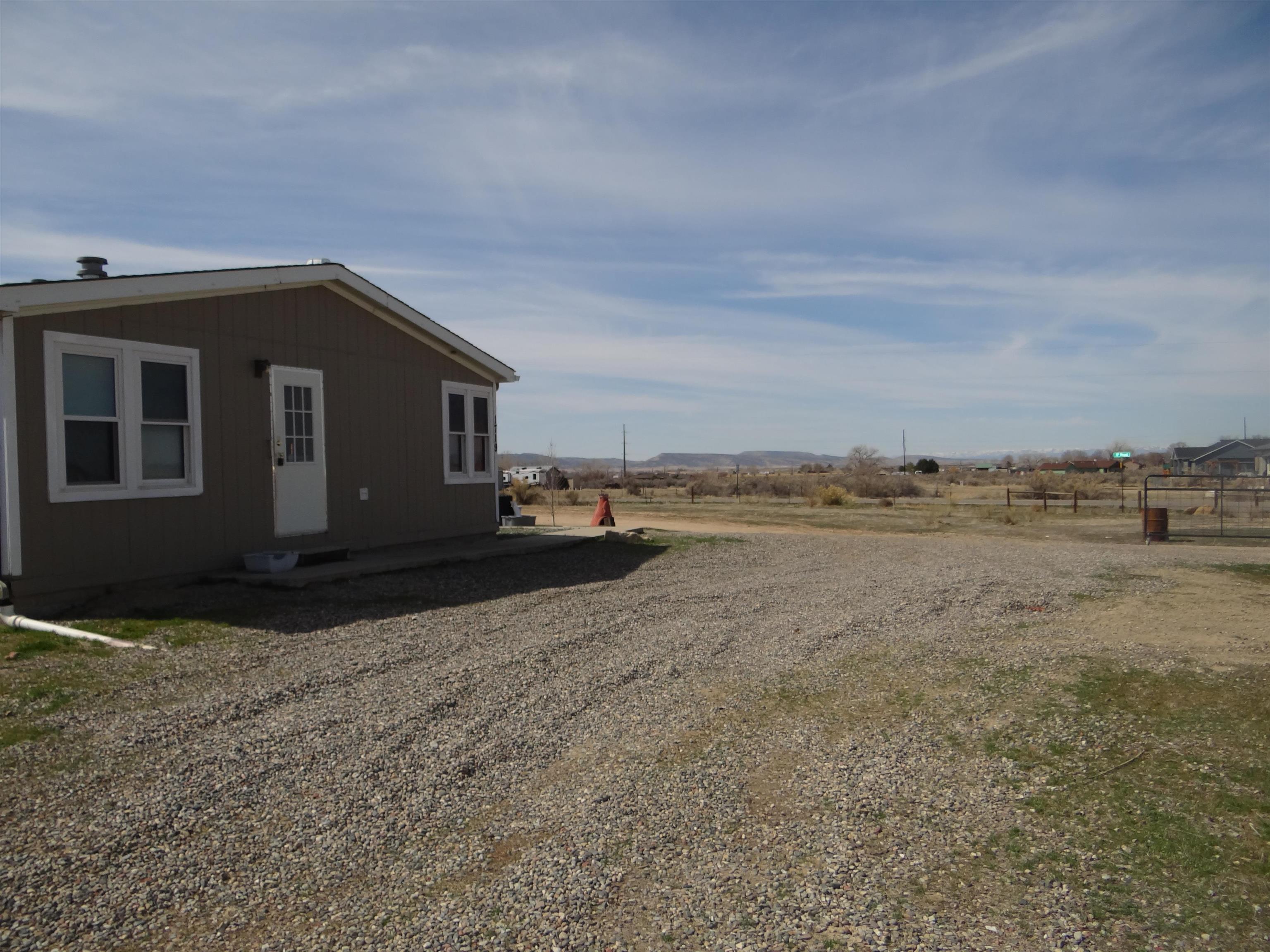 1719 P Road Loma, CO 81524 - Photo 5 of 12 a view of a house with a yard