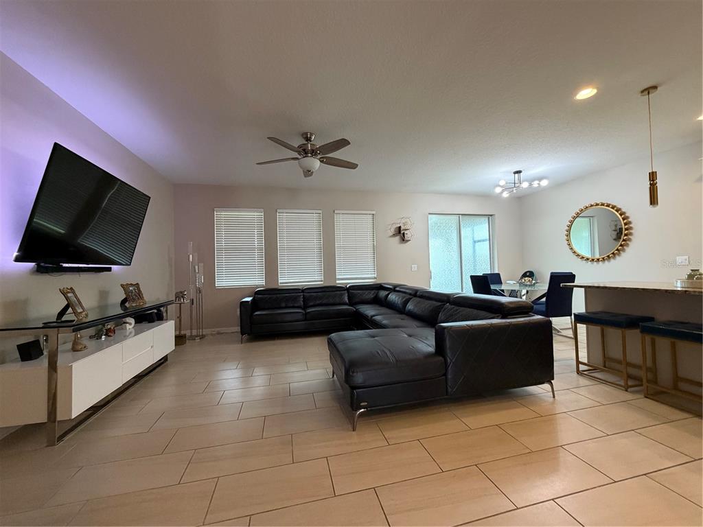 1834 Castleton Drive St. Cloud, FL 34771 - Photo 11 of 33 a living room with furniture and a flat screen tv