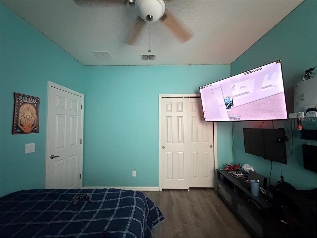1834 Castleton Drive St. Cloud, FL 34771 - Photo 26 of 33 a room with furniture and a flat screen tv