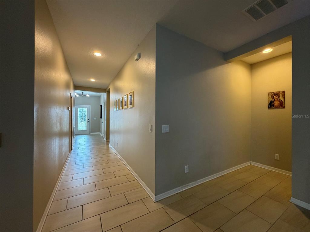 1834 Castleton Drive St. Cloud, FL 34771 - Photo 27 of 33 a view of a hallway with wooden floor