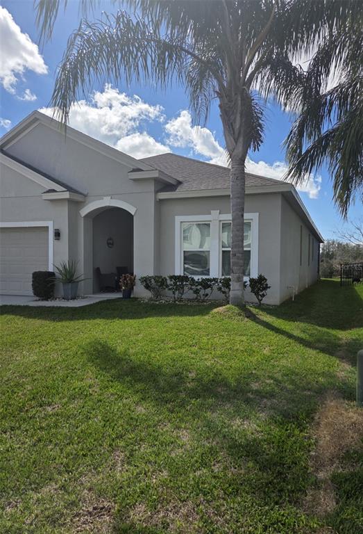 1834 Castleton Drive St. Cloud, FL 34771 - Photo 3 of 33 a front view of house with yard and outdoor seating