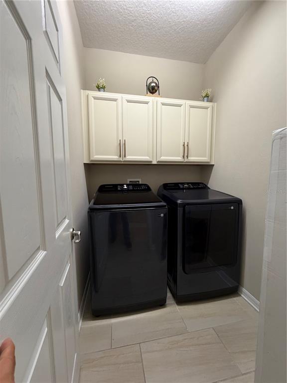 1834 Castleton Drive St. Cloud, FL 34771 - Photo 32 of 33 a kitchen with a stove and a cabinet