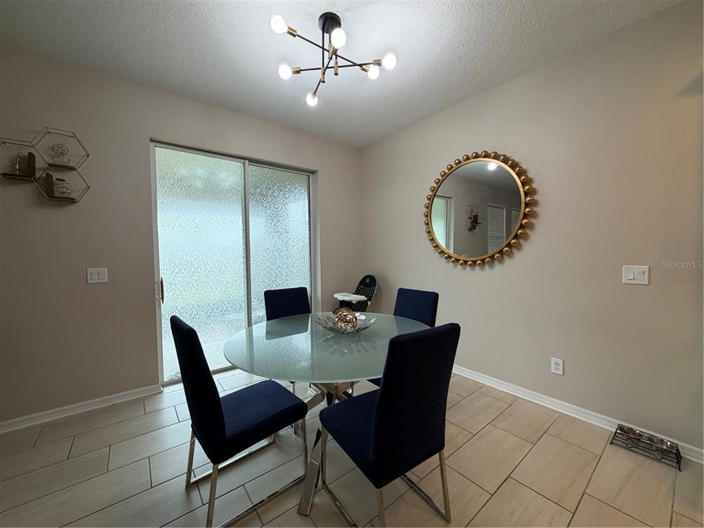 1834 Castleton Drive St. Cloud, FL 34771 - Photo 9 of 33 a view of a dining room with furniture