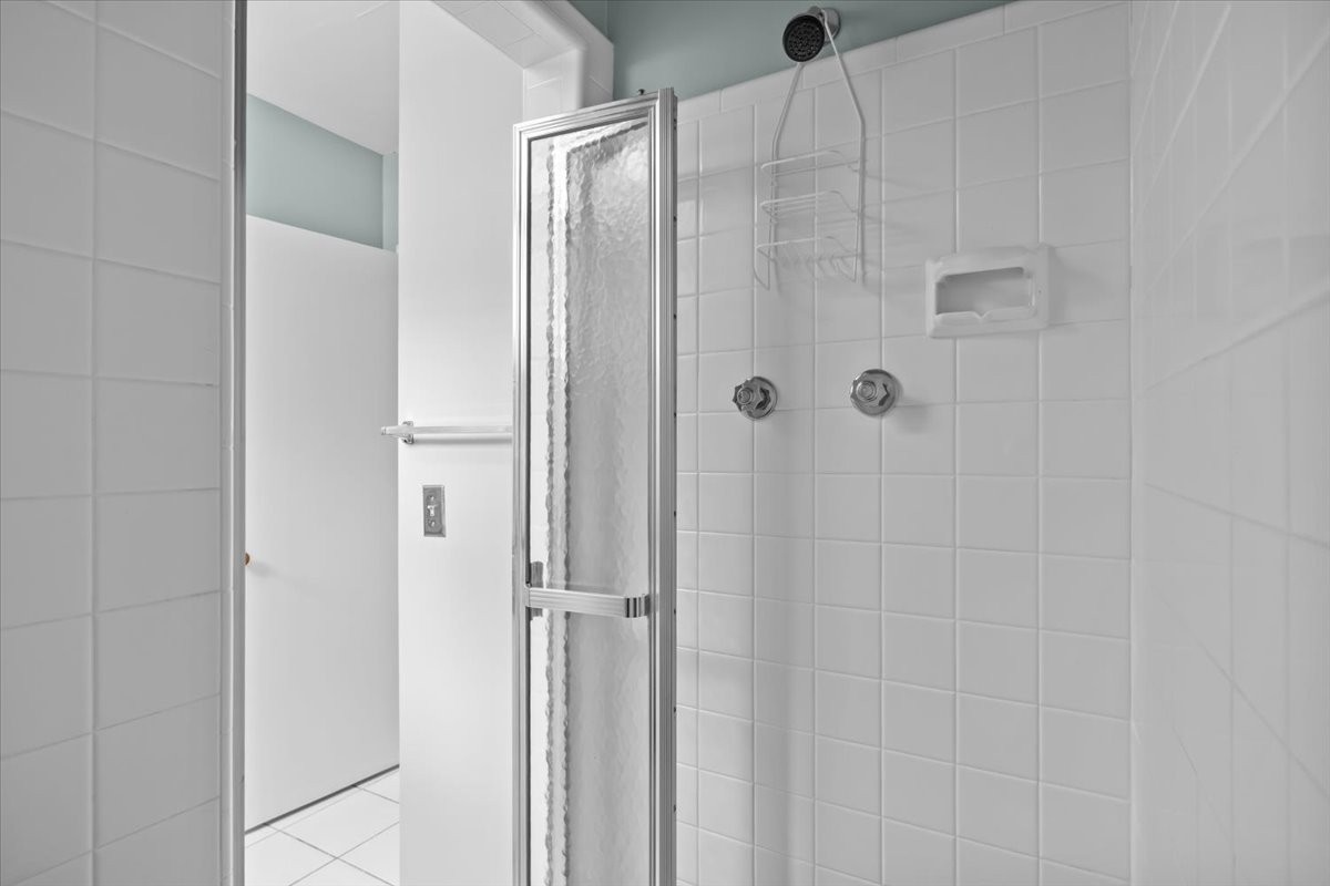 935 Evans Road Nashville, TN 37204 - Photo 32 of 44 a bathroom with a glass shower door
