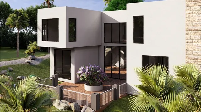 a view of a house with a small yard and plants