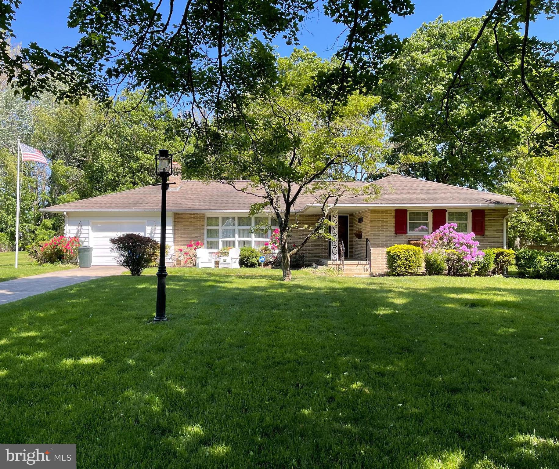 2 Cedar Lane Pemberton, NJ 08068 - Photo 1 of 56 a front view of a house with a garden