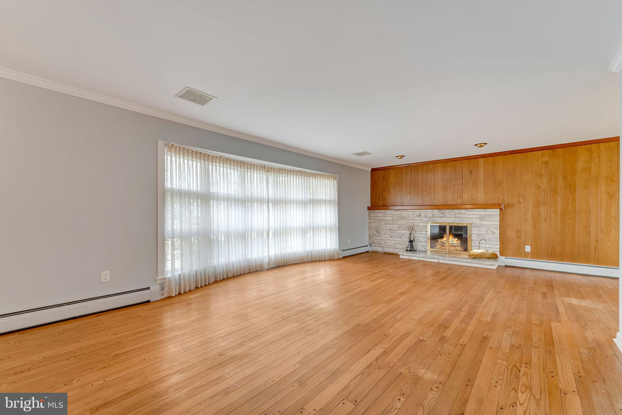 2 Cedar Lane Pemberton, NJ 08068 - Photo 11 of 56 a view of an empty room with a window and wooden floor